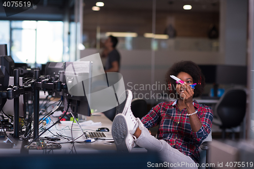 Image of portrait of a young successful African-American woman in modern 