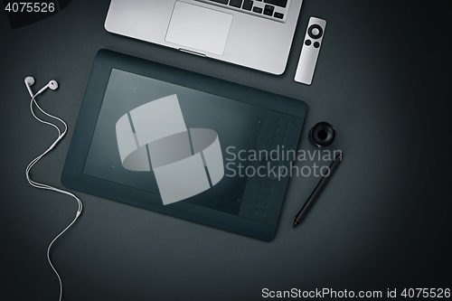 Image of Workplace of business. Modern male accessories and laptop on black background