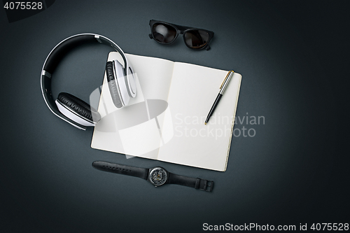 Image of Still life of casual man. Modern male accessories on black