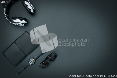 Image of Still life of casual man. Modern male accessories on black