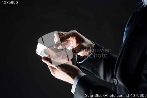 Image of close up of businessman with glass smartphone