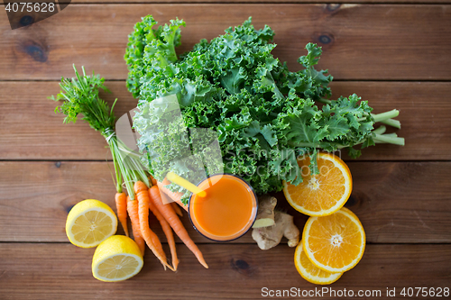 Image of glass of carrot juice, fruits and vegetables