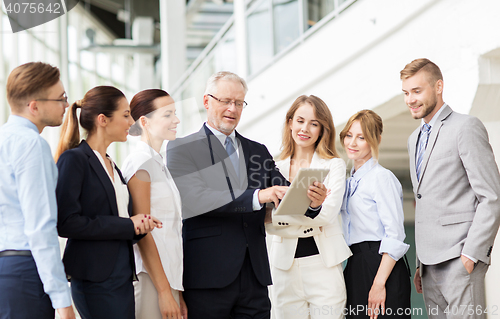 Image of business people with tablet pc computer at office