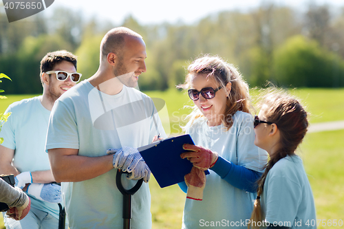 Image of group of volunteers planting trees in park