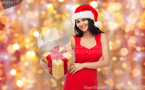 Image of beautiful sexy woman in santa hat with gift box