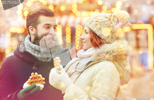 Image of happy couple walking in old town