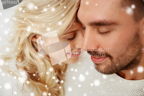 Image of close up of happy couple faces with closed eyes