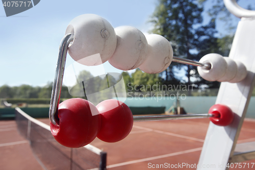 Image of Red clay's tennis court with net