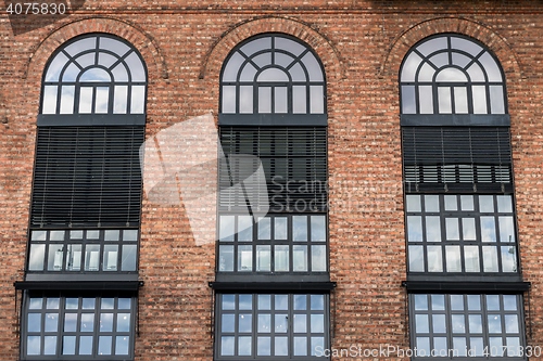 Image of Large windows on brick wall