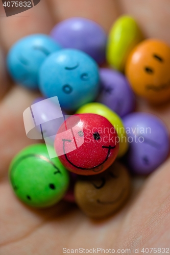 Image of Smiling candy in hands