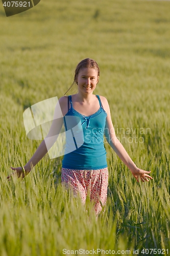 Image of Woman walking on the field