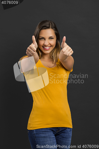 Image of Happy woman with thumb up