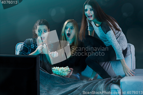 Image of Scared teenage watching movies 