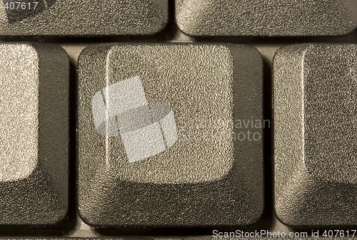 Image of computer key in a keyboard with letter, number and symbols