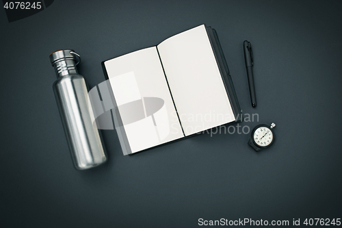Image of Still life of casual man. Modern male accessories on black
