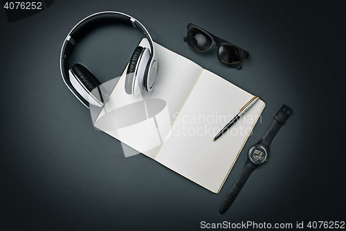 Image of Still life of casual man. Modern male accessories on black