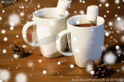 Image of cups of hot chocolate with marshmallow on wood