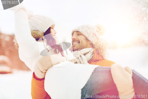 Image of happy couple outdoors in winter