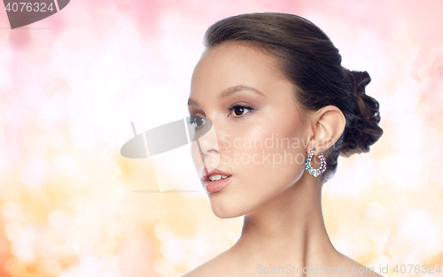 Image of close up of beautiful woman face with earring