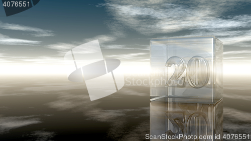 Image of number twenty in glass cube under cloudy sky - 3d rendering