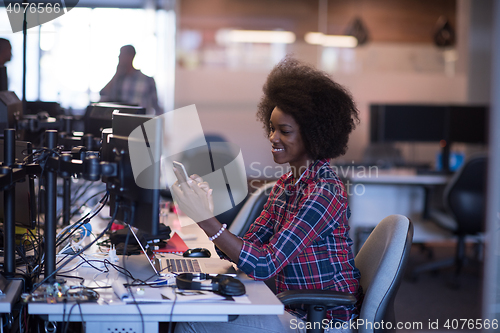 Image of portrait of a young successful African-American woman in modern 