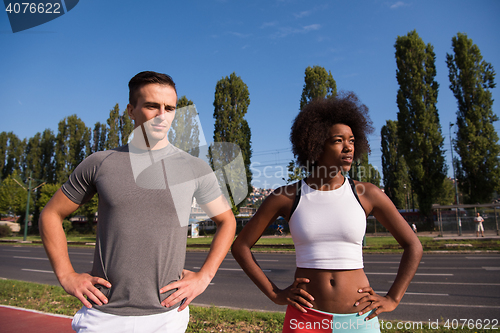 Image of Portrait of romantic pretty couple on fitness session, outside t