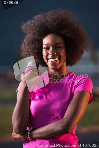 Image of Portrait of a young african american woman running outdoors