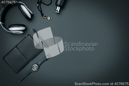 Image of Still life of casual man. Modern male accessories on black