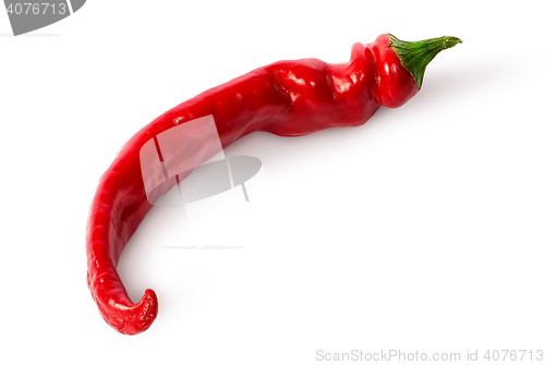 Image of Single curved chili peppers on the side