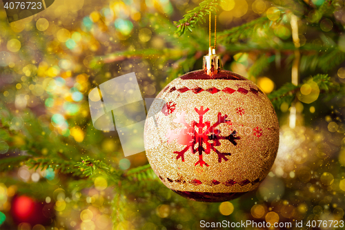 Image of Decoration bauble on decorated Christmas tree background