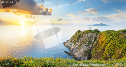 Image of Hong Kong lighthouse during sunrise