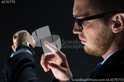 Image of close up of businessman with smart watch