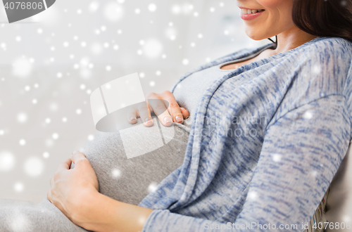 Image of close up of happy pregnant woman at home