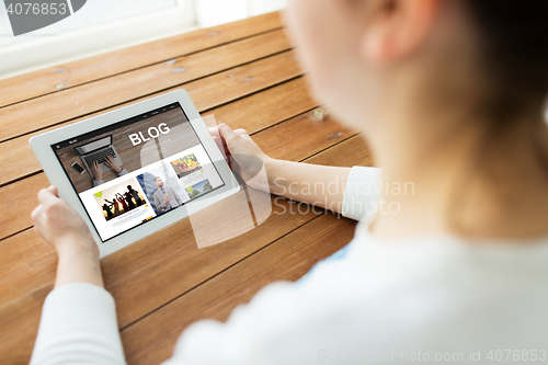 Image of close up of woman with blog on tablet pc