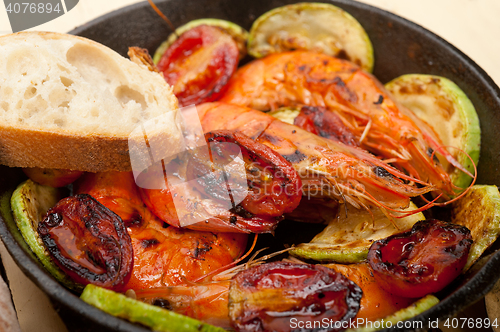 Image of roasted shrimps with zucchini and tomatoes