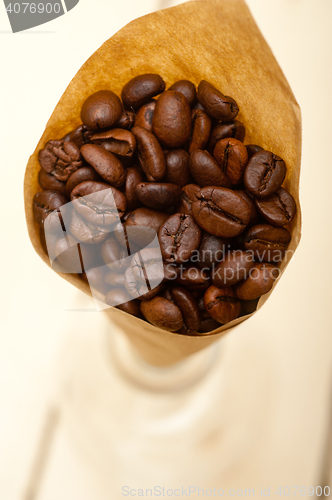 Image of espresso coffee beans on a paper cone