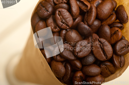 Image of espresso coffee beans on a paper cone