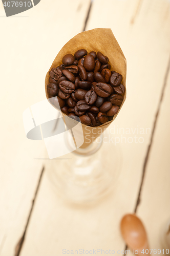 Image of espresso coffee beans on a paper cone