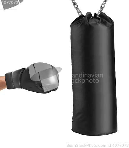 Image of boxing glove punches punching bag