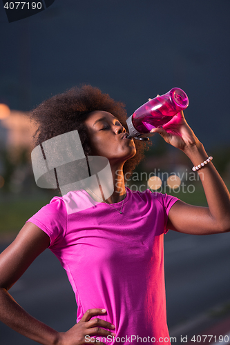 Image of Portrait of a young african american woman running outdoors