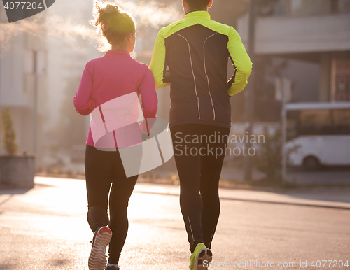 Image of young  couple jogging