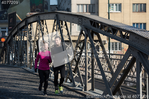 Image of young  couple jogging