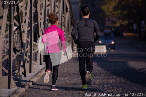 Image of young  couple jogging