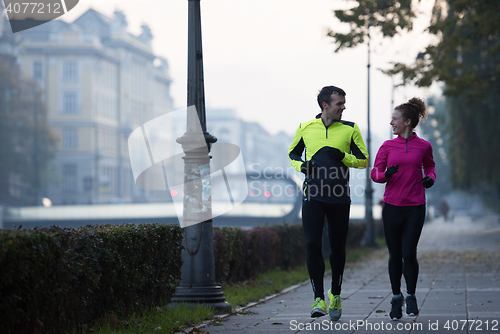 Image of young  couple jogging