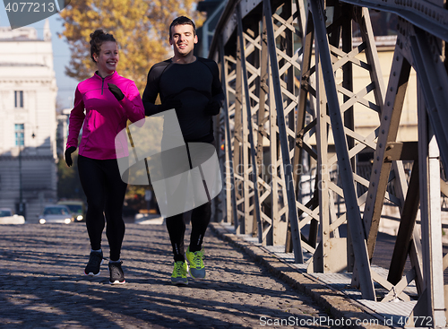 Image of young  couple jogging