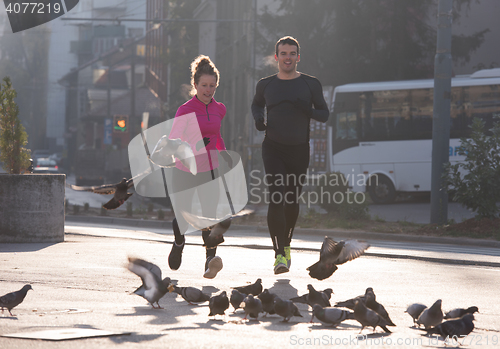 Image of young  couple jogging