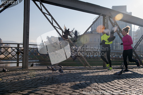 Image of young  couple jogging