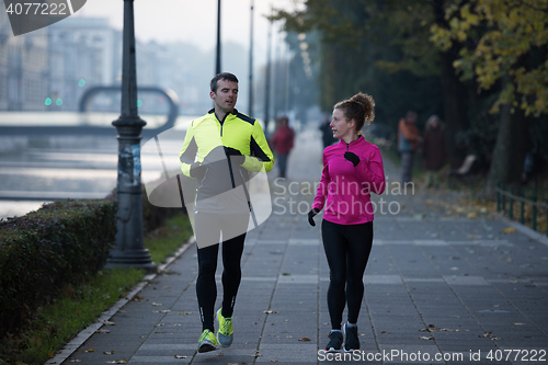 Image of young  couple jogging