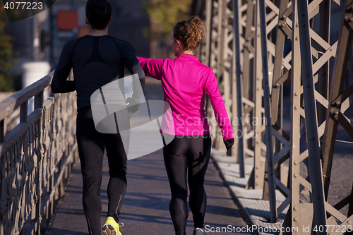 Image of young  couple jogging