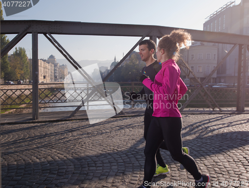 Image of young  couple jogging